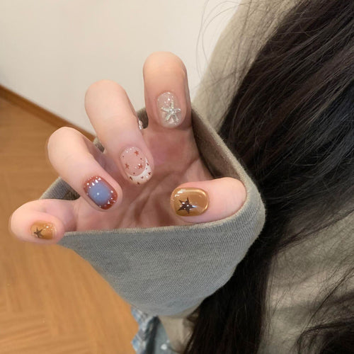 Artificial nails in modern design with star and gradient elements Bowlift