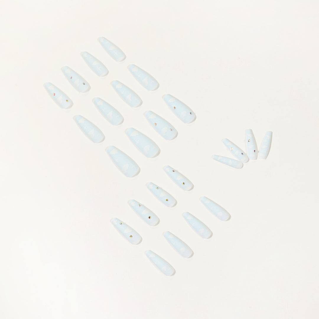 Creative nail art in cloud design with glitter accents Bowlift