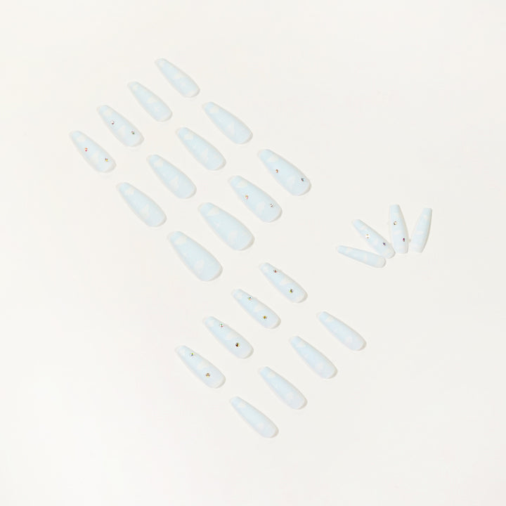 Creative nail art in cloud design with glitter accents Bowlift