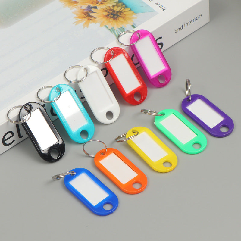 Unisex writable keychain with clear labeling field Bowlift