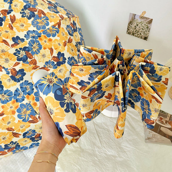 Women Folding Umbrella with Detailed Floral Design Bowlift