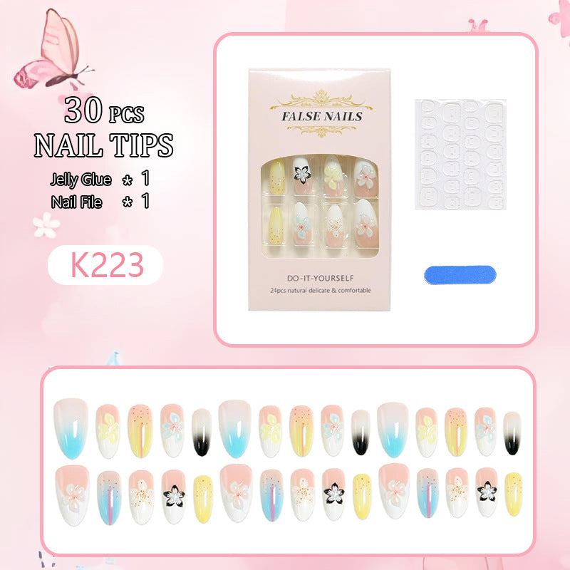 Artificial nail set with floral and glittering decorations Bowlift