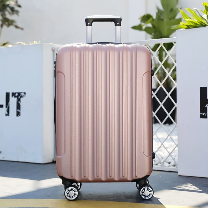 Hard shell suitcase with 360-degree wheel system and integrated safety feature Bowlift