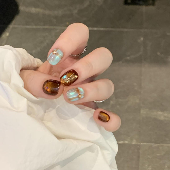 Artificial nail art tips with shimmer and glitter Bowlift