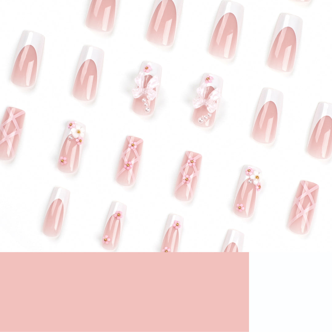 Artificial nail extensions with floral accents Bowlift