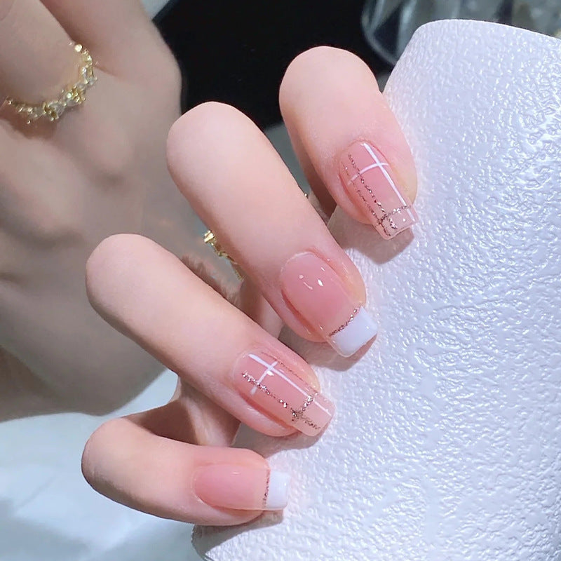 Nail set with elegant French tip and fashionable embellishments Bowlift