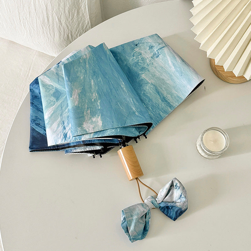 Ladies elegant folding umbrella with unique marble pattern Bowlift