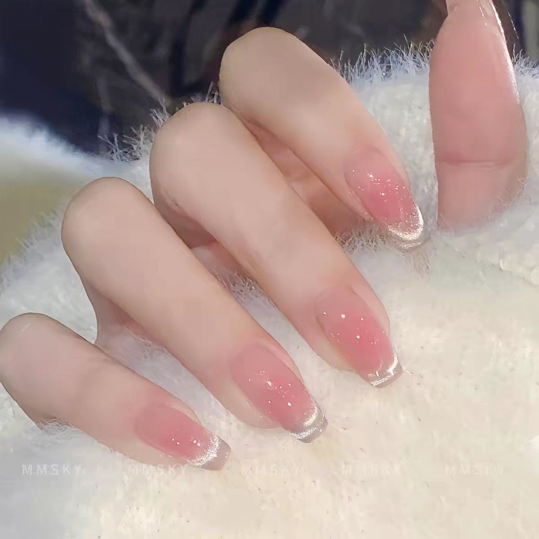 Artificial nails with elegant ombre effect and glitter coating Bowlift