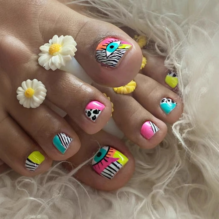 Artificial nail set with vibrant color accents and geometric patterns Bowlift