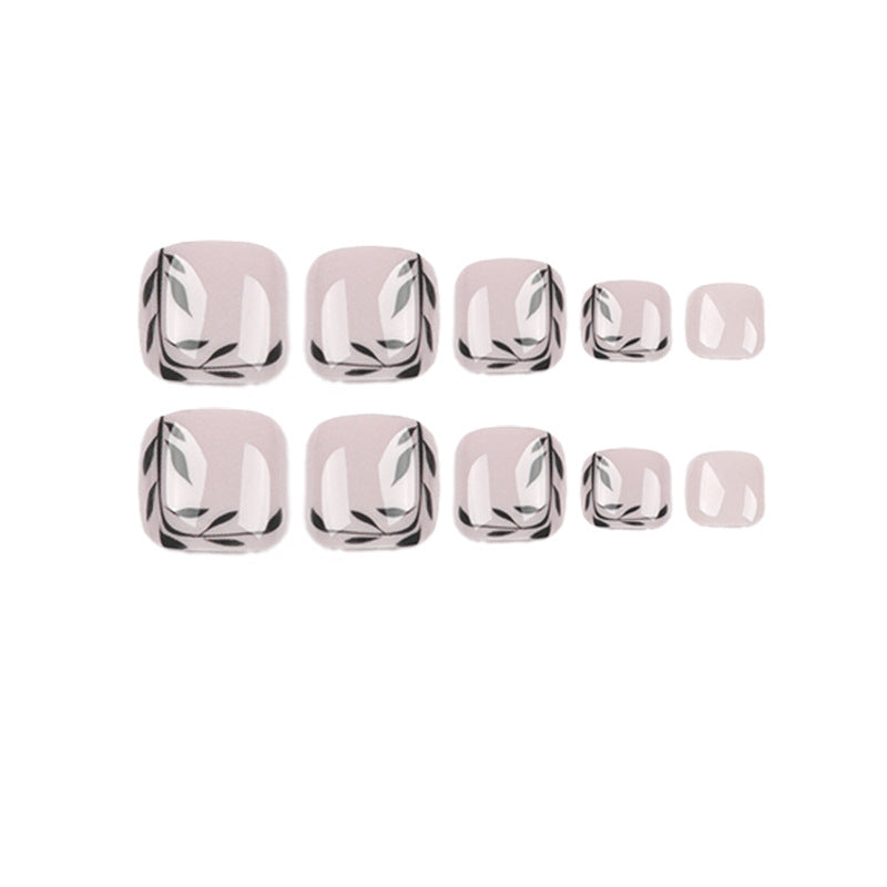 Artful toenail art with delicate leaf motifs Bowlift
