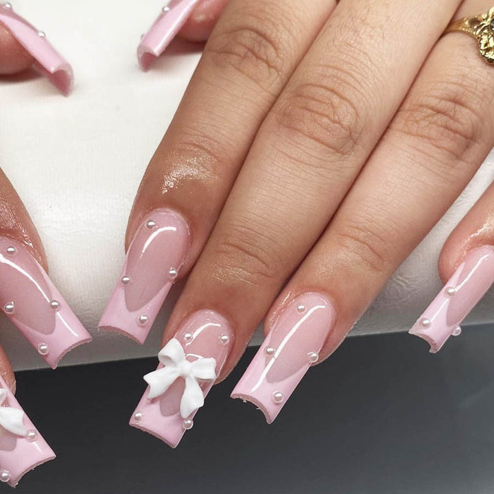 Artificial nail set with romantic bow and pearl embellishments Bowlift