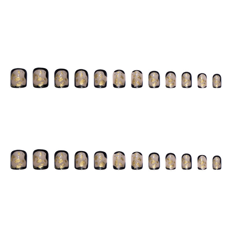 Artificial nail set with delicate gold accents and elegant finish Bowlift