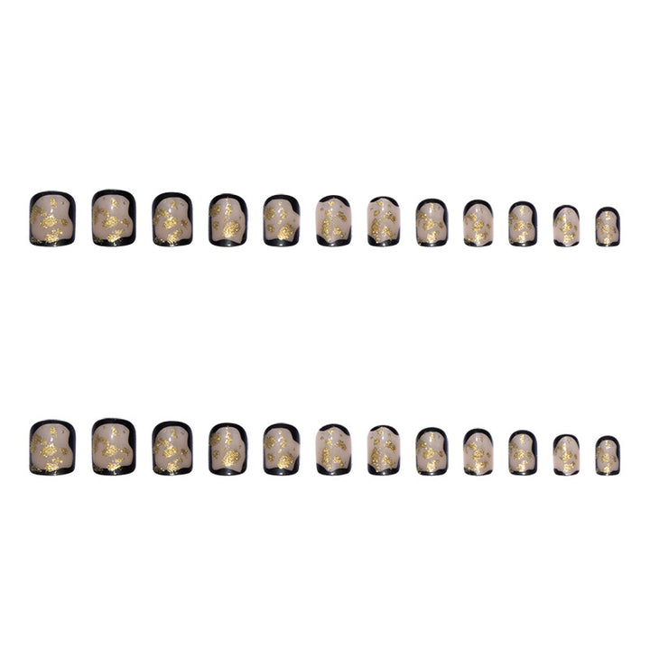 Artificial nail set with delicate gold accents and elegant finish Bowlift