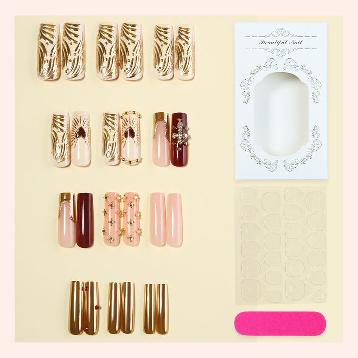 Acrylic nail set with luxurious golden accents and sparkling embellishments Bowlift