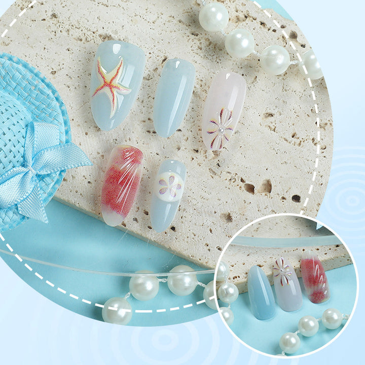 Artificial nails with maritime shell motifs Bowlift