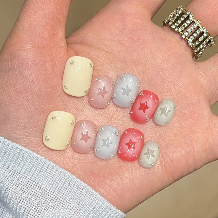 Artificial nails with sparkling star motifs Bowlift