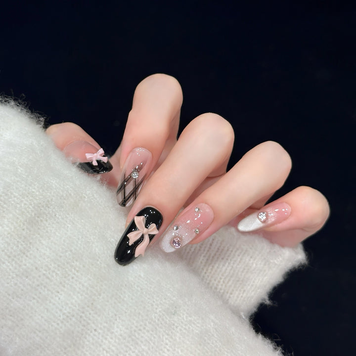 Artificial nail tips with elegant bows and glitter details Bowlift