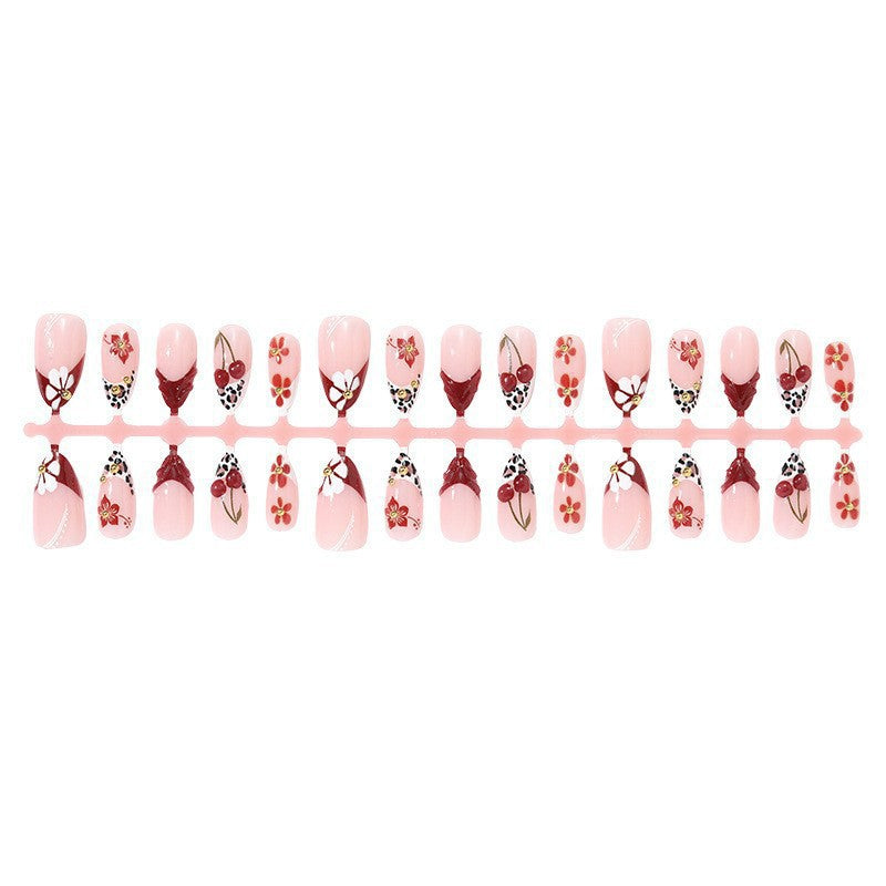 Elegant artificial nails with floral accents and glitter Bowlift