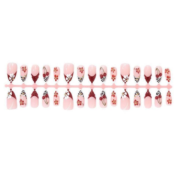 Elegant artificial nails with floral accents and glitter Bowlift
