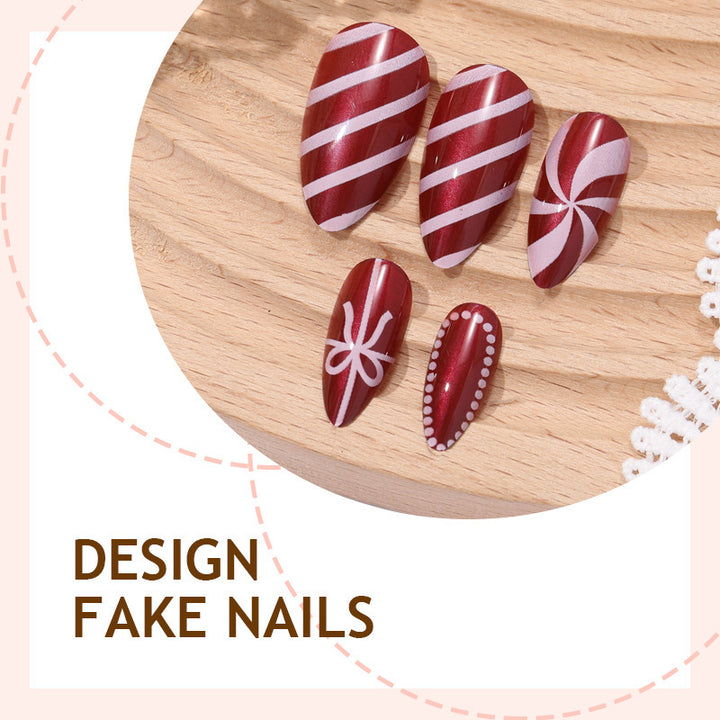 artfully designed nail set with festive candy cane motifs Bowlift