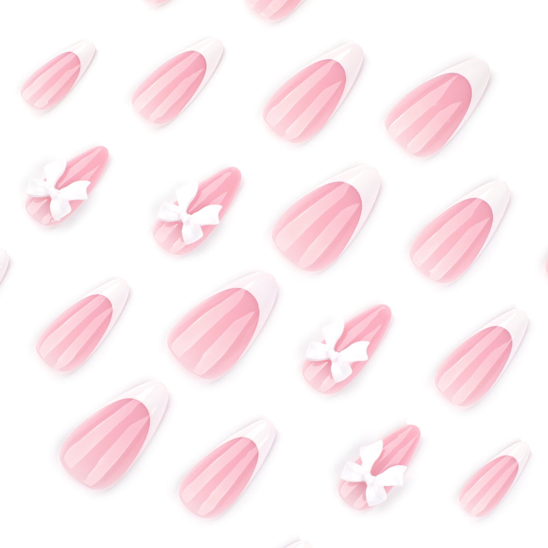 Artful nail designs with elegant tips and delicate bow motifs Bowlift