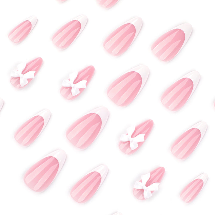 Artful nail designs with elegant tips and delicate bow motifs Bowlift