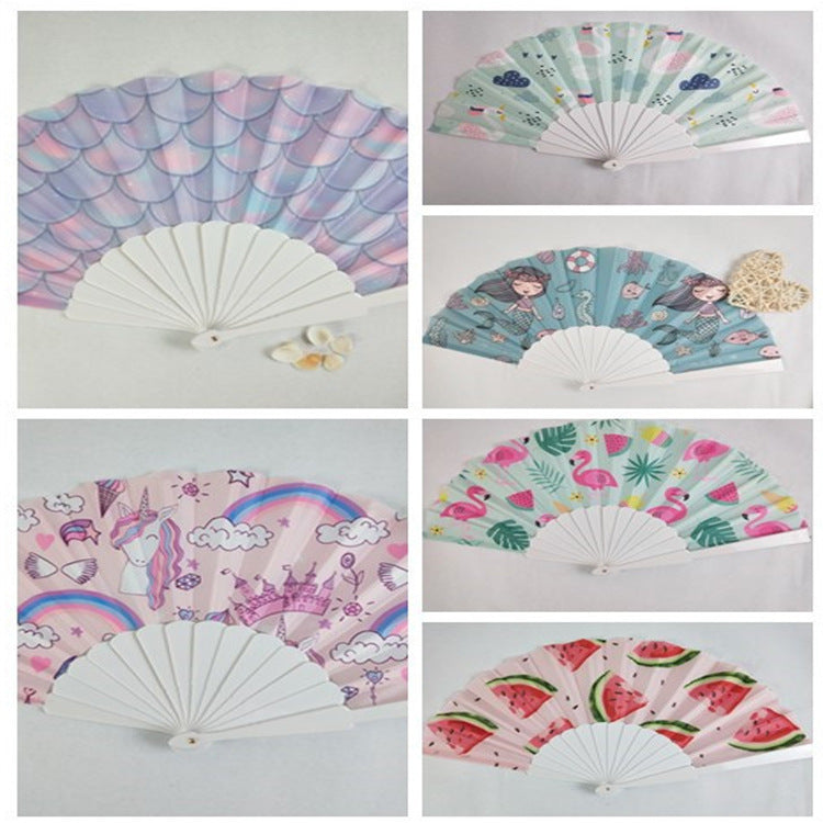 Women folding hand fan with shimmering scale pattern Bowlift