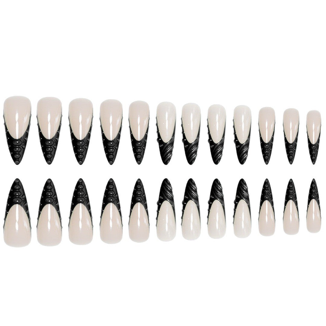 Artistic Stiletto Nail Extensions with Textured Detailing Bowlift