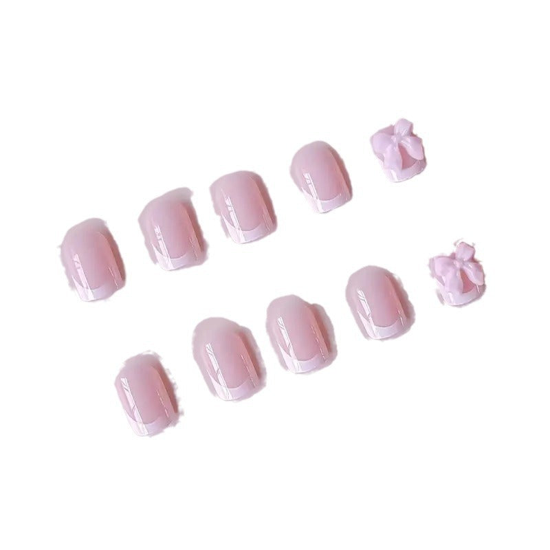 Elegant French Tip Press-On Nails with Bow Detail Bowlift