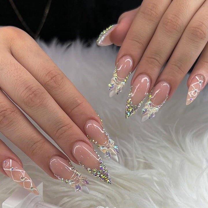 Acrylic nail set with luxurious rhinestone embellishments and bow accents Bowlift