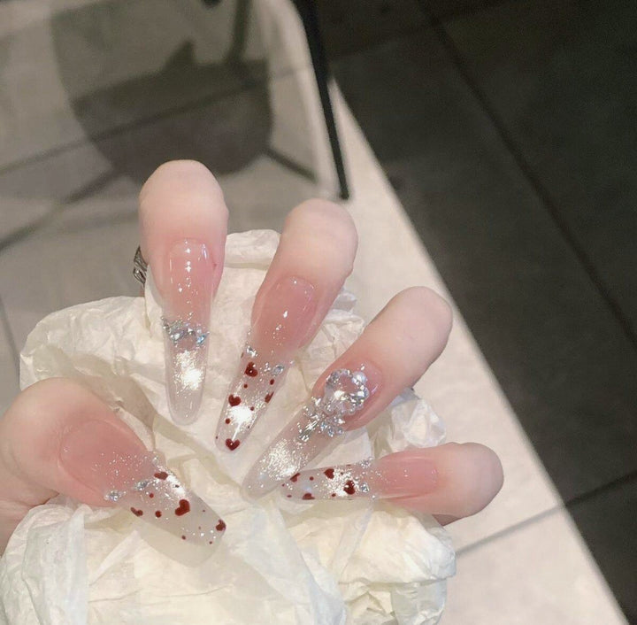 Artistic Stiletto Press-On Nail Art with Glimmering Accents Bowlift