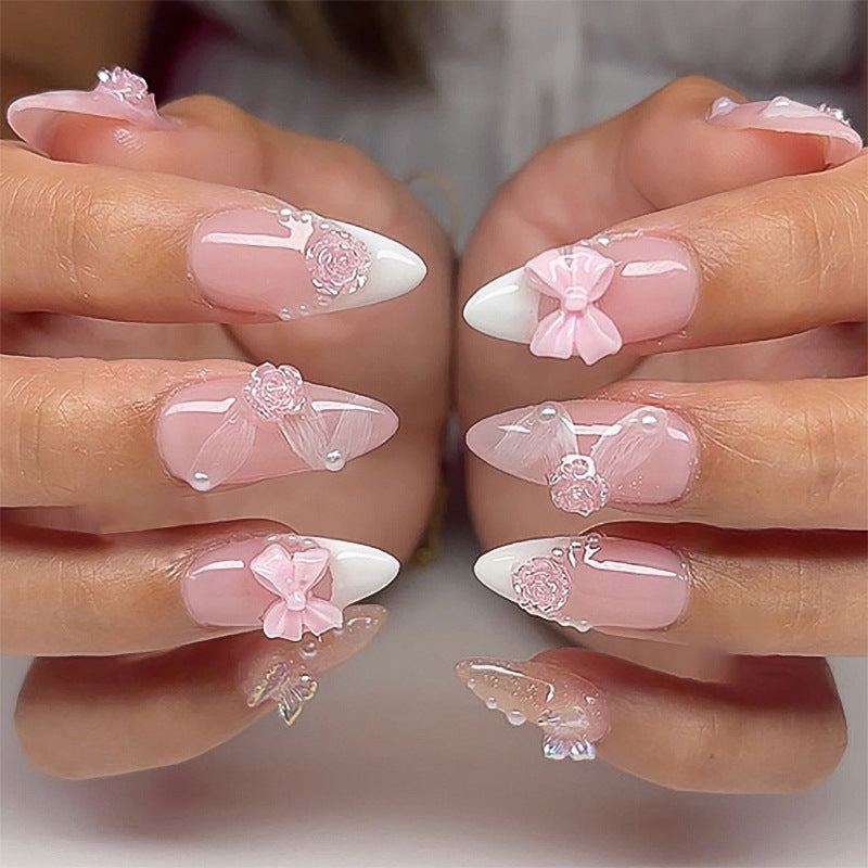 Artistic nail extensions with floral decorations and glitter accents Bowlift