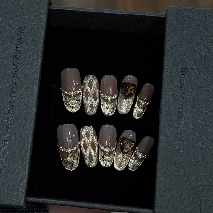 Glamorous artificial nails with glitter and heart design Bowlift