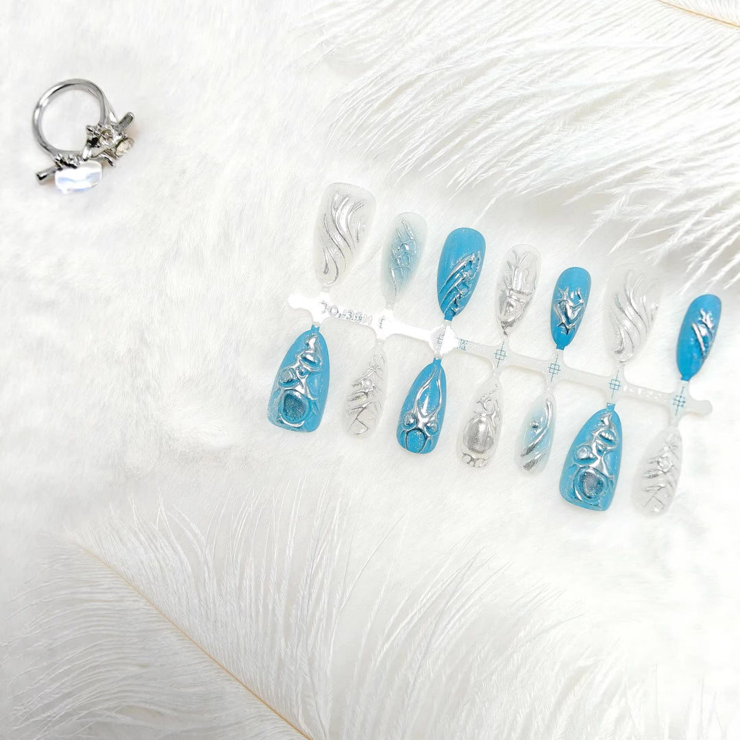 Creative artificial nails with shiny silver and turquoise tones Bowlift