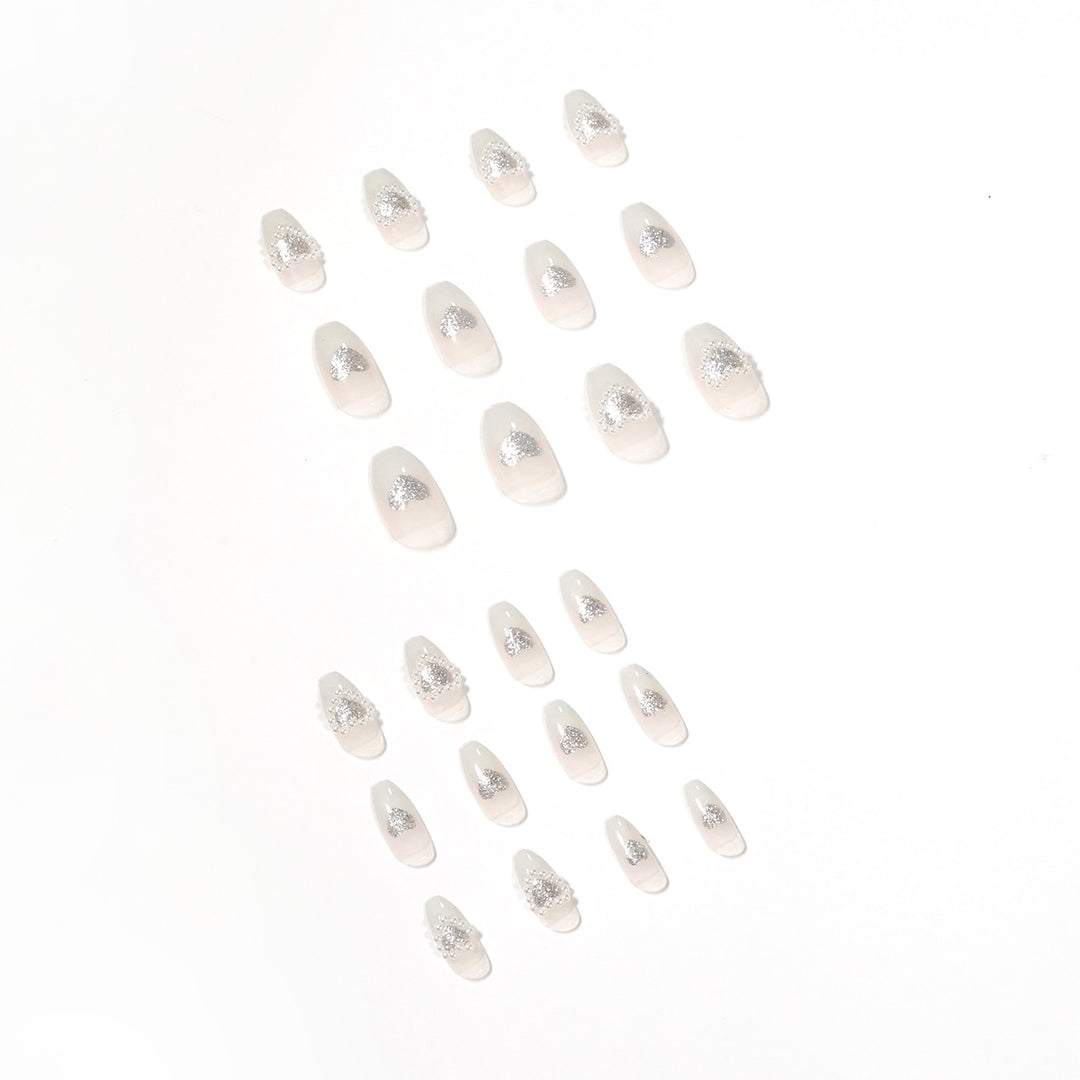 Artificial nail art with heart and rhinestone decorations Bowlift