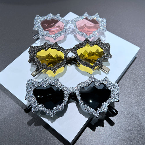 Ladies creative sunglasses in an extravagant design with glitter embellishments Bowlift