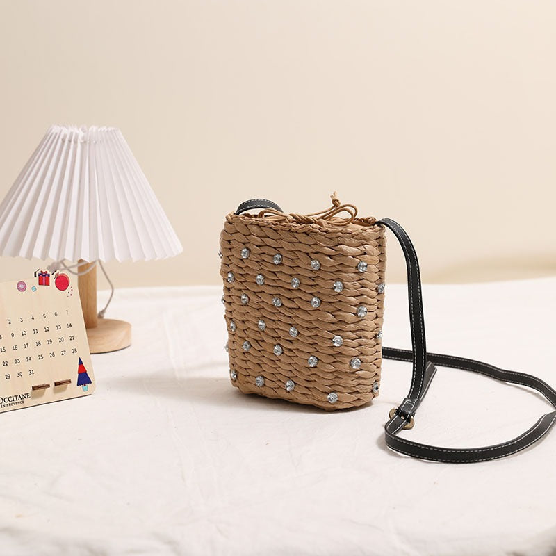 Bag made of woven natural material with sparkling appliqués Bowlift