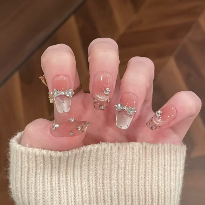 Artificial nails with elegant ombre effect and glitter coating Bowlift