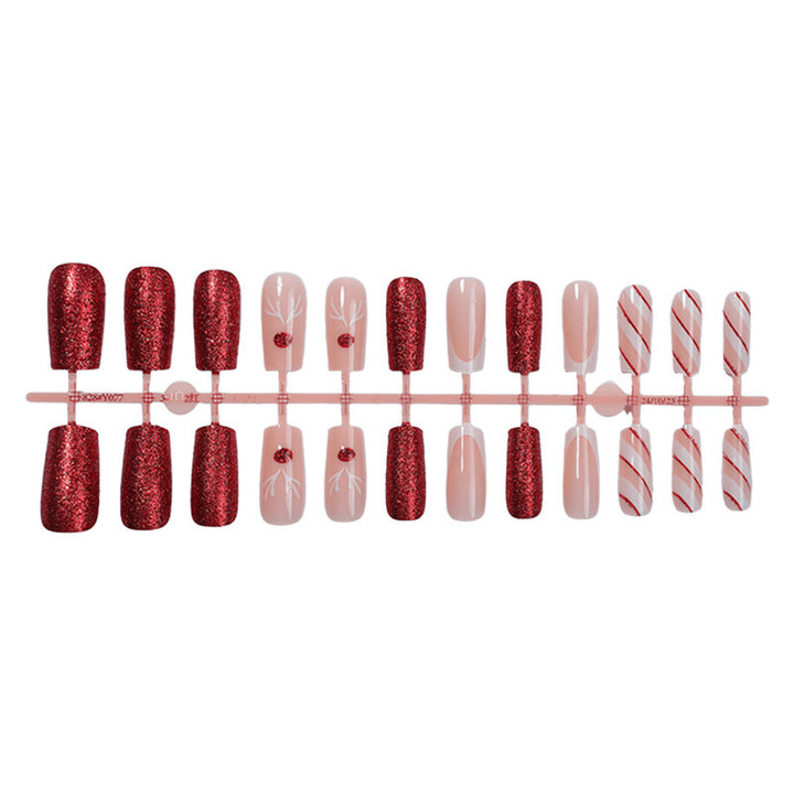 Artificial nail set with sparkling glitter and festive accents Bowlift