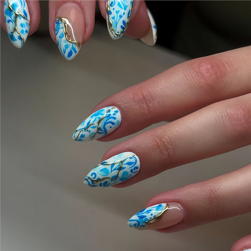 Artistic Floral Press-On Nail Design with Gold Accents Bowlift