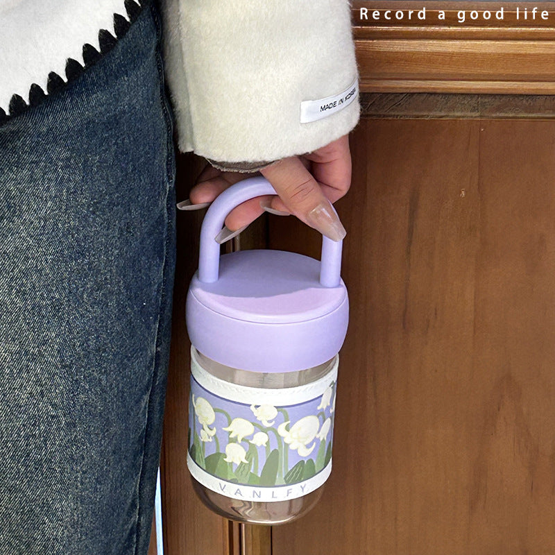 Women's insulated drinking bottle with ergonomic carrying handle and elegant flower design Bowlift