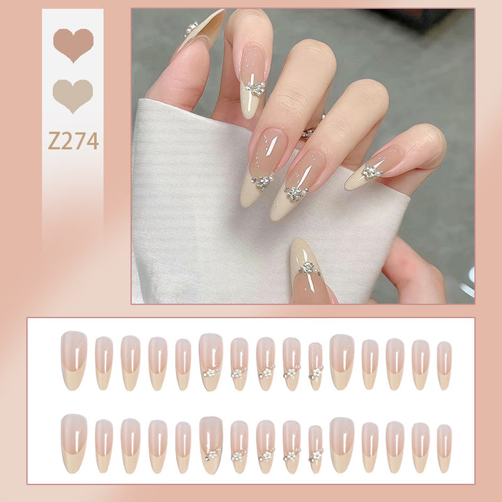 Acrylic nail set with elegant tips and sparkling appliqués Bowlift