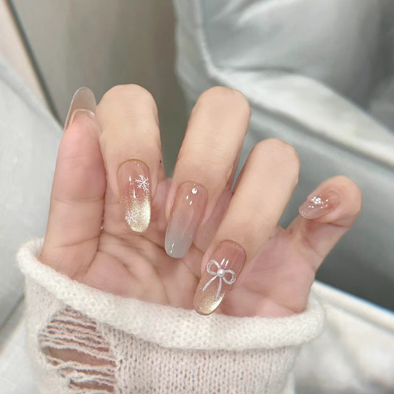 Elegant Press-On Nail Set with Snowflake and Bow Designs Bowlift