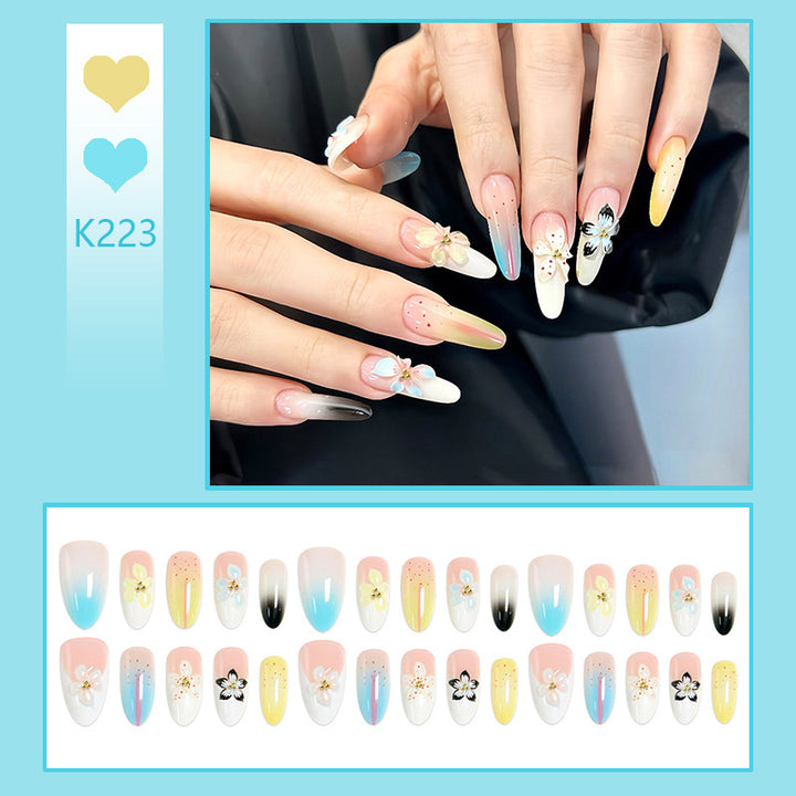 Artificial nail set with floral and glittering decorations Bowlift