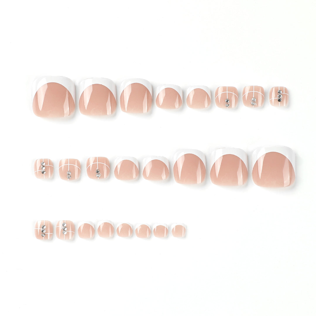Artful toenail design with elegant style and rhinestone embellishments Bowlift