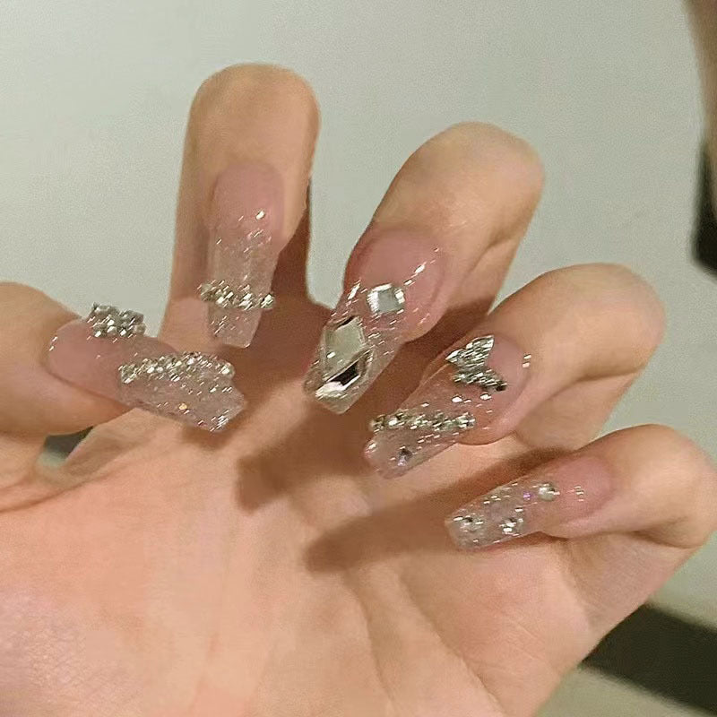 Glamorous artificial nails with sparkling rhinestones and elegant designs Bowlift