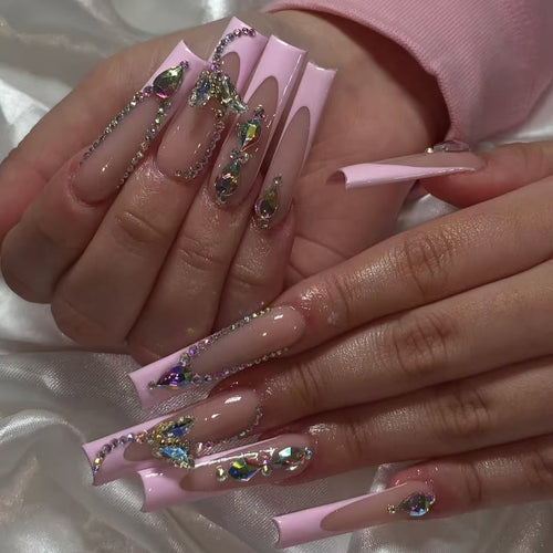 Acrylic nail set with elegant glitter and rhinestone accents Bowlift