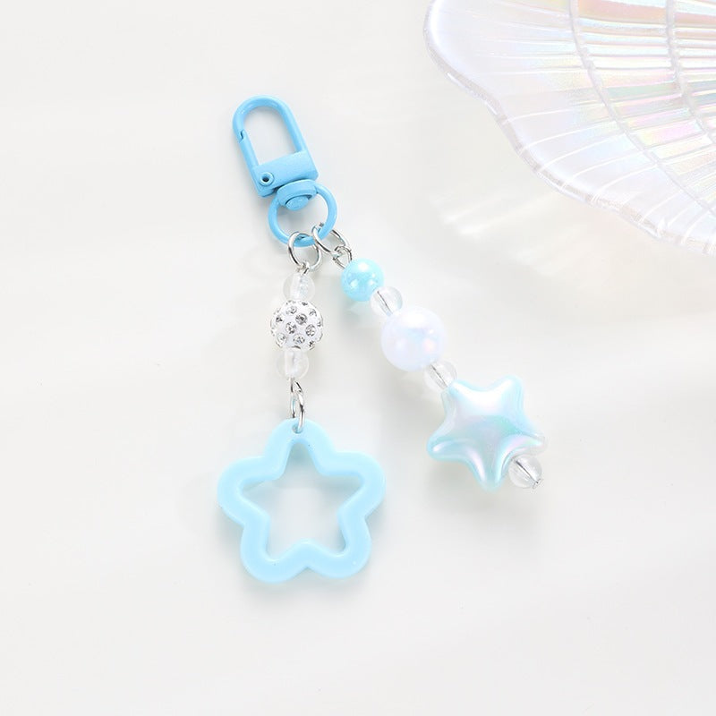 Playful keychain with floral and star motif Bowlift