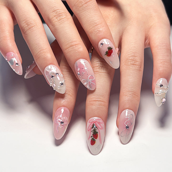 Artificial nail art with romantic design and glitter accents Bowlift