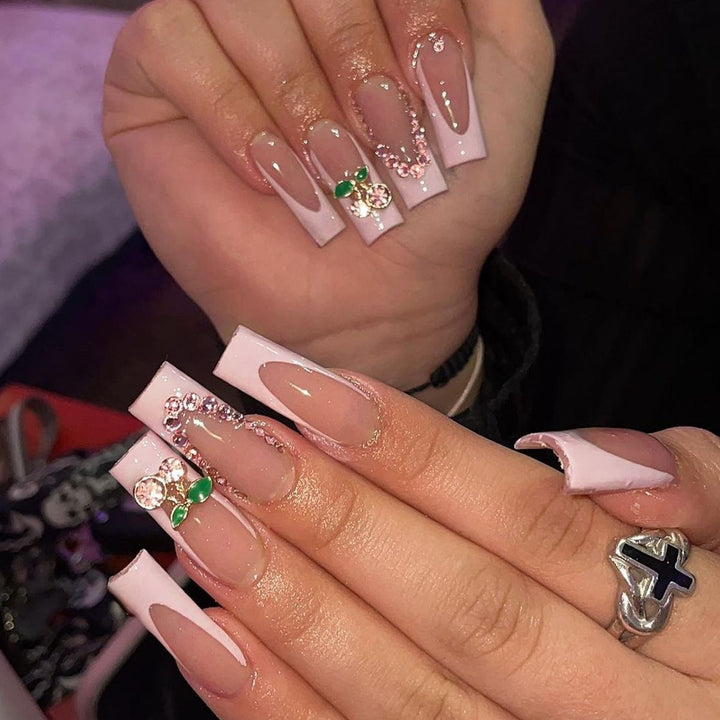 Creative acrylic nail set with delicate pearl and gloss accents Bowlift